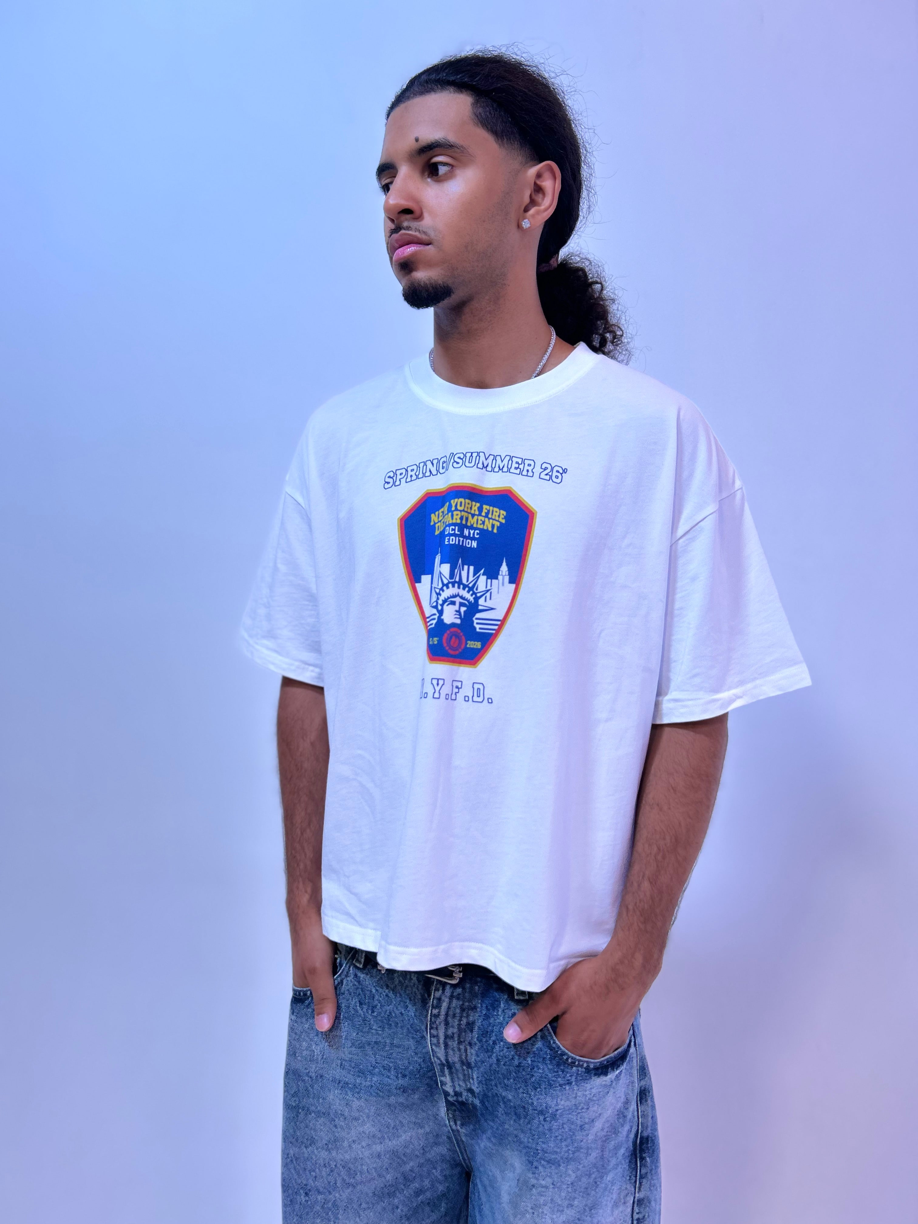 A man wearing a white Summit No.26 graphic t-shirt