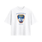 A white short-sleeve crewneck t-shirt featuring a New York City Fire Department shield graphic on the chest with the text 'SPRING SUMMER 27' and 'N.Y.